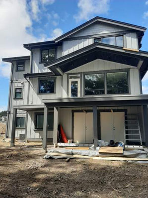 Newly built three-storey home painted grey and white